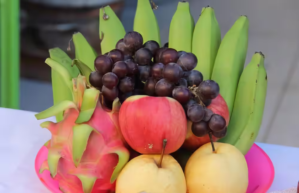 Dragon fruit in a fruit bowl on the kitchen bench